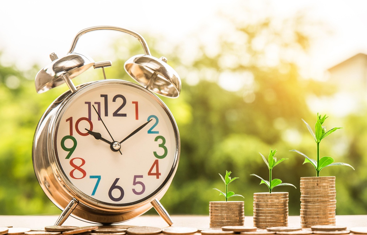 Financial growth over time with coins and clock